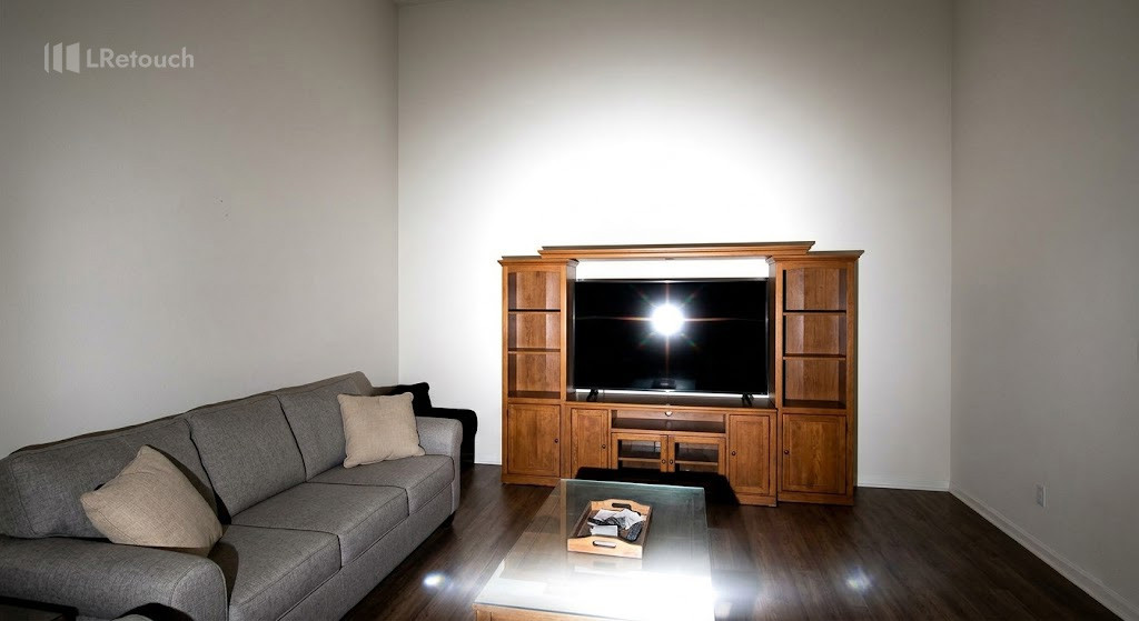 Amateur property photo showing misuse of flash with harsh highlights and hard shadows.